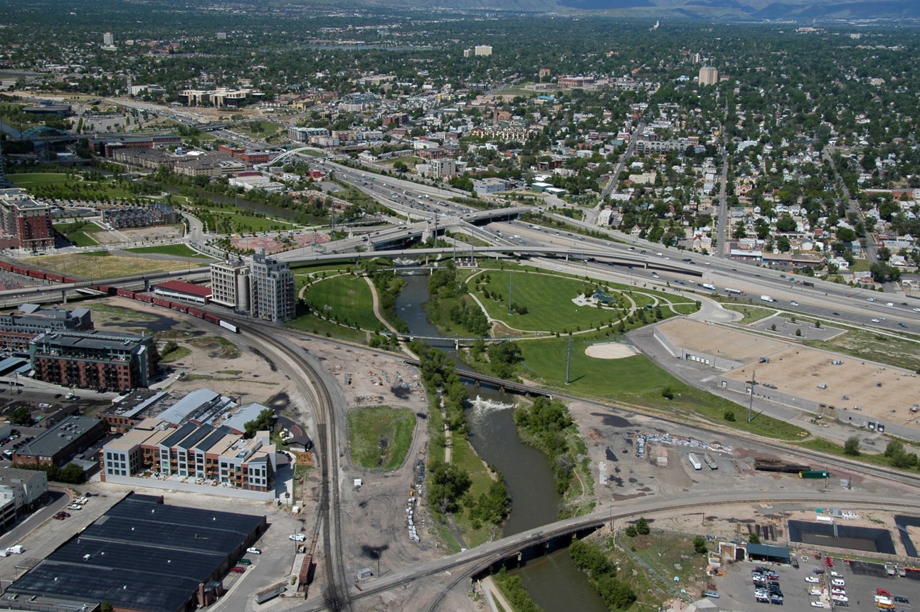 Aerial photo of river moving through city